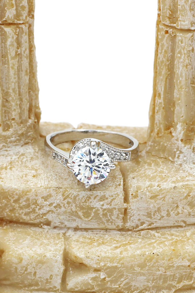 four grabbed twisted arm crystal ring