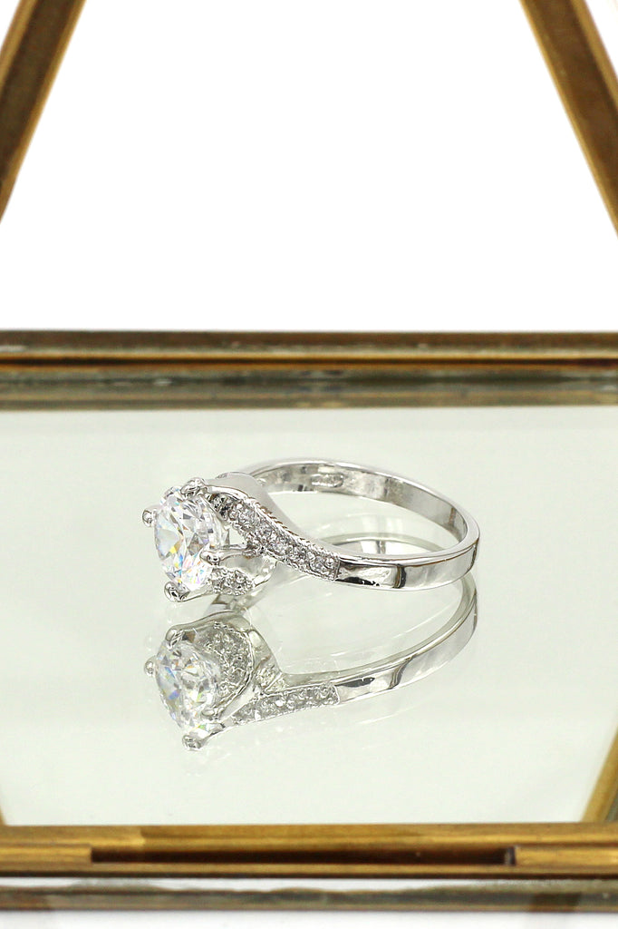 four grabbed twisted arm crystal ring