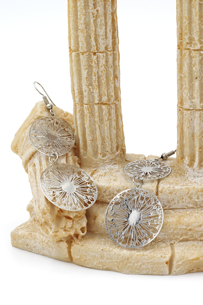 Hollow carved round metal earrings