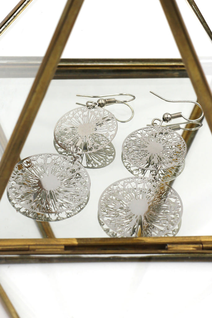 Hollow carved round metal earrings