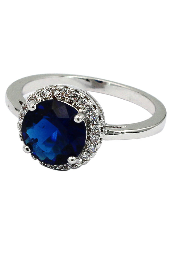 A layer micro-inlaid surrounded blue crystal silver ring
