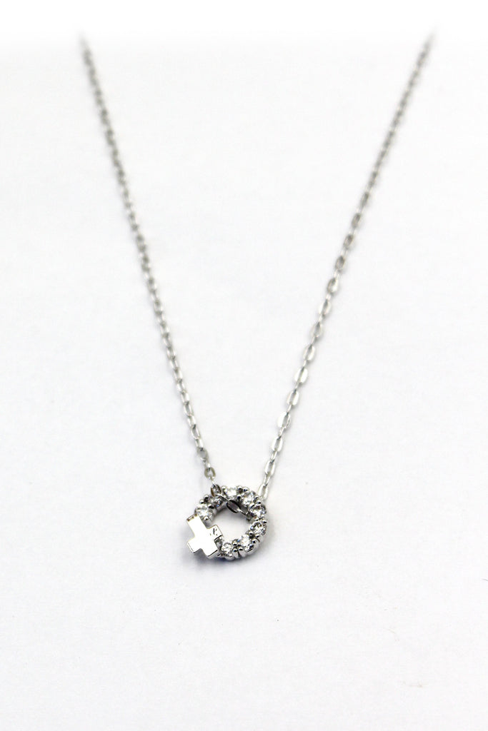 Crystal circle mini cross necklace