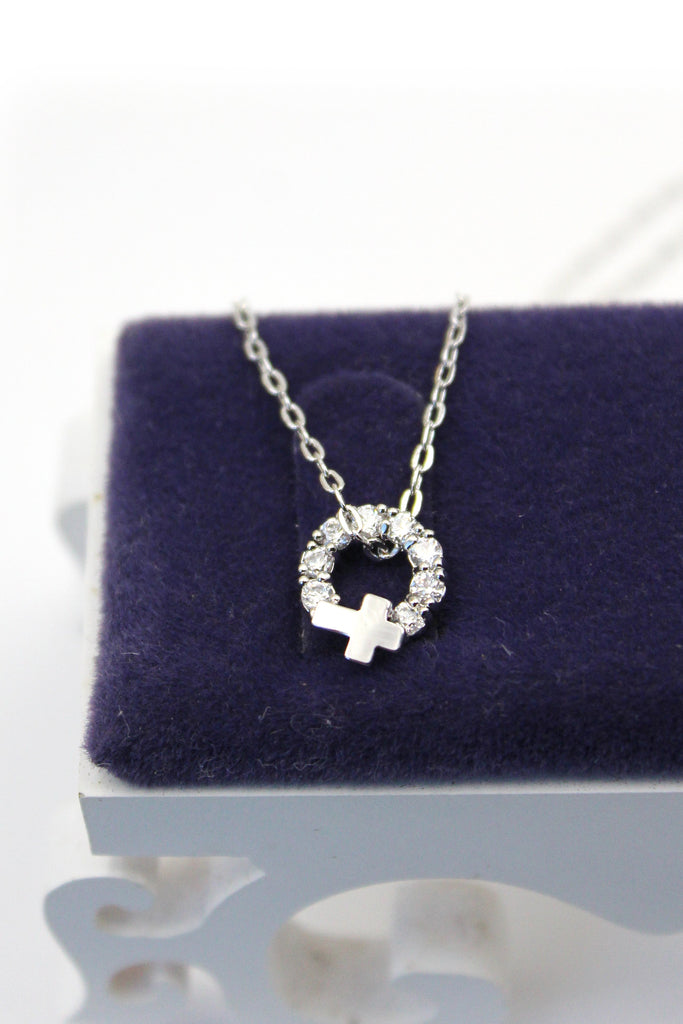 Crystal circle mini cross necklace