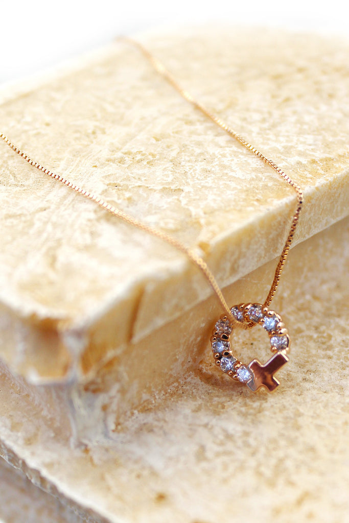 Crystal circle mini cross necklace