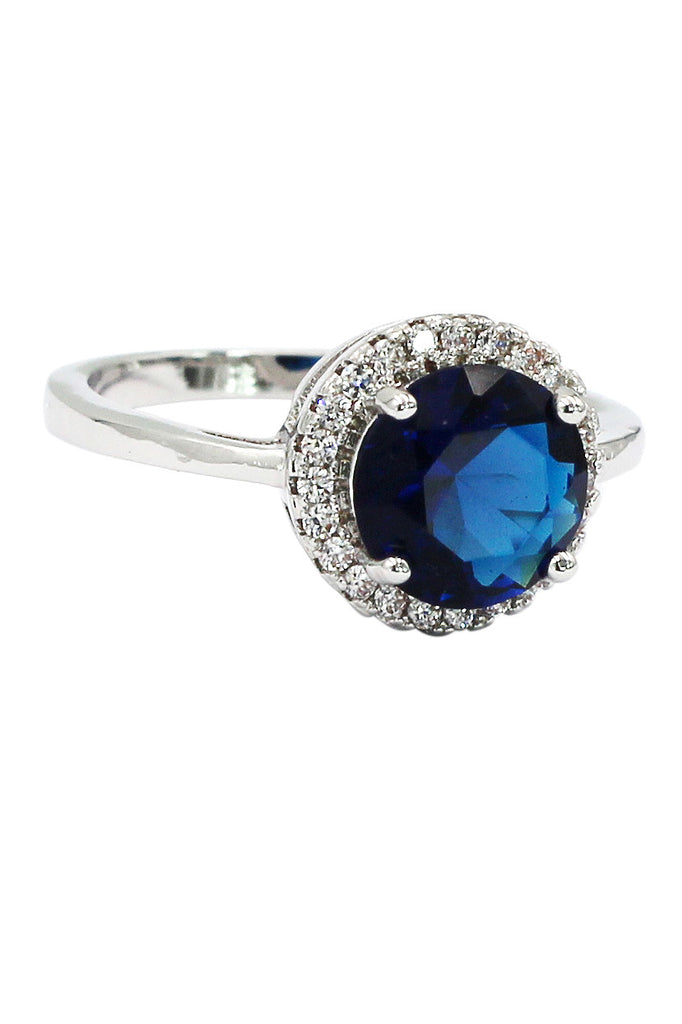 A layer micro-inlaid surrounded blue crystal silver ring