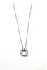 Crystal circle mini cross necklace
