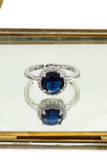 A layer micro-inlaid surrounded blue crystal silver ring